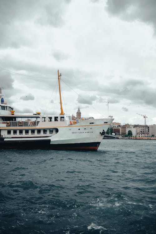 A Passenger Ship Sailing on the Bosphorus Strait with the View of Istanbul 