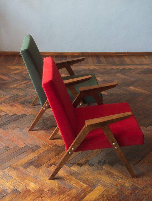 Red and Green Armchairs on Floor
