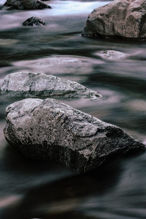 Slit Between Rocks Long Exposure of Water Flowing between Rocks on the Shore · Free Stock ...
