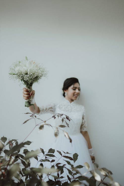 Bride Posing and Holding Bouquet