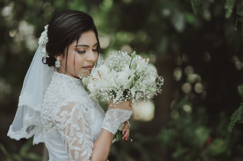 Beautiful Bride Holding a Bouquet of Flowers 