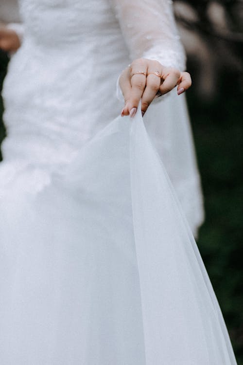 Bride Hand Holding Wedding Dress