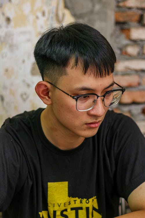 Candid Portrait of a Young Man in Eyeglasses 