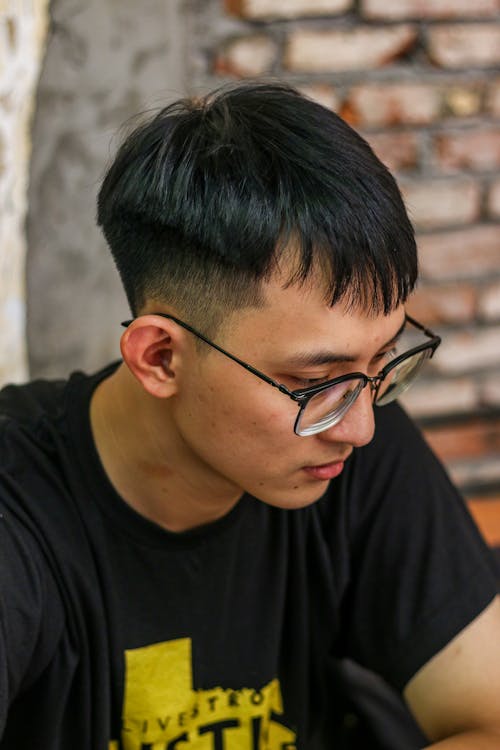 Candid Portrait of a Young Man in Eyeglasses 