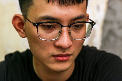 Close-up Portrait of a Young Man in Eyeglasses 