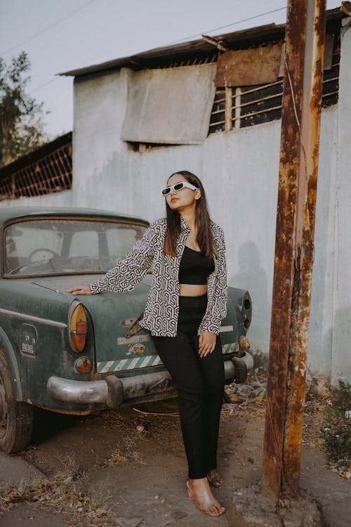 Woman Standing and Posing near Vintage Car