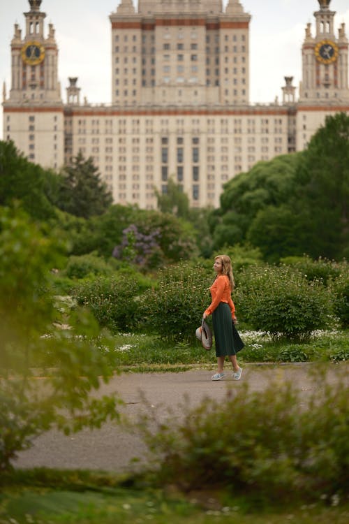 Woman Posing in Park with Moscow State University behind