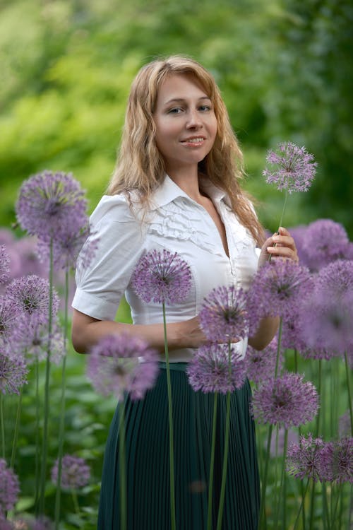 Woman Posing among Flowers