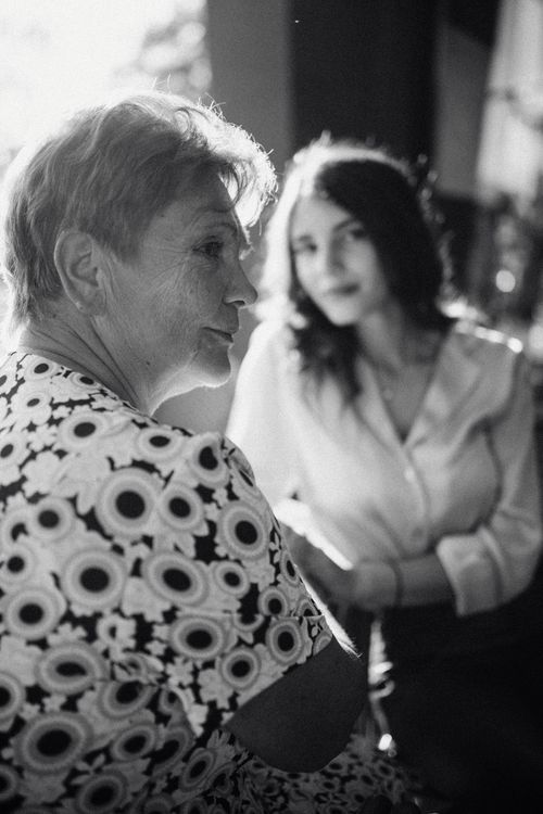 Free Black and white portrait of two women, highlighting generational connection. Stock Photo