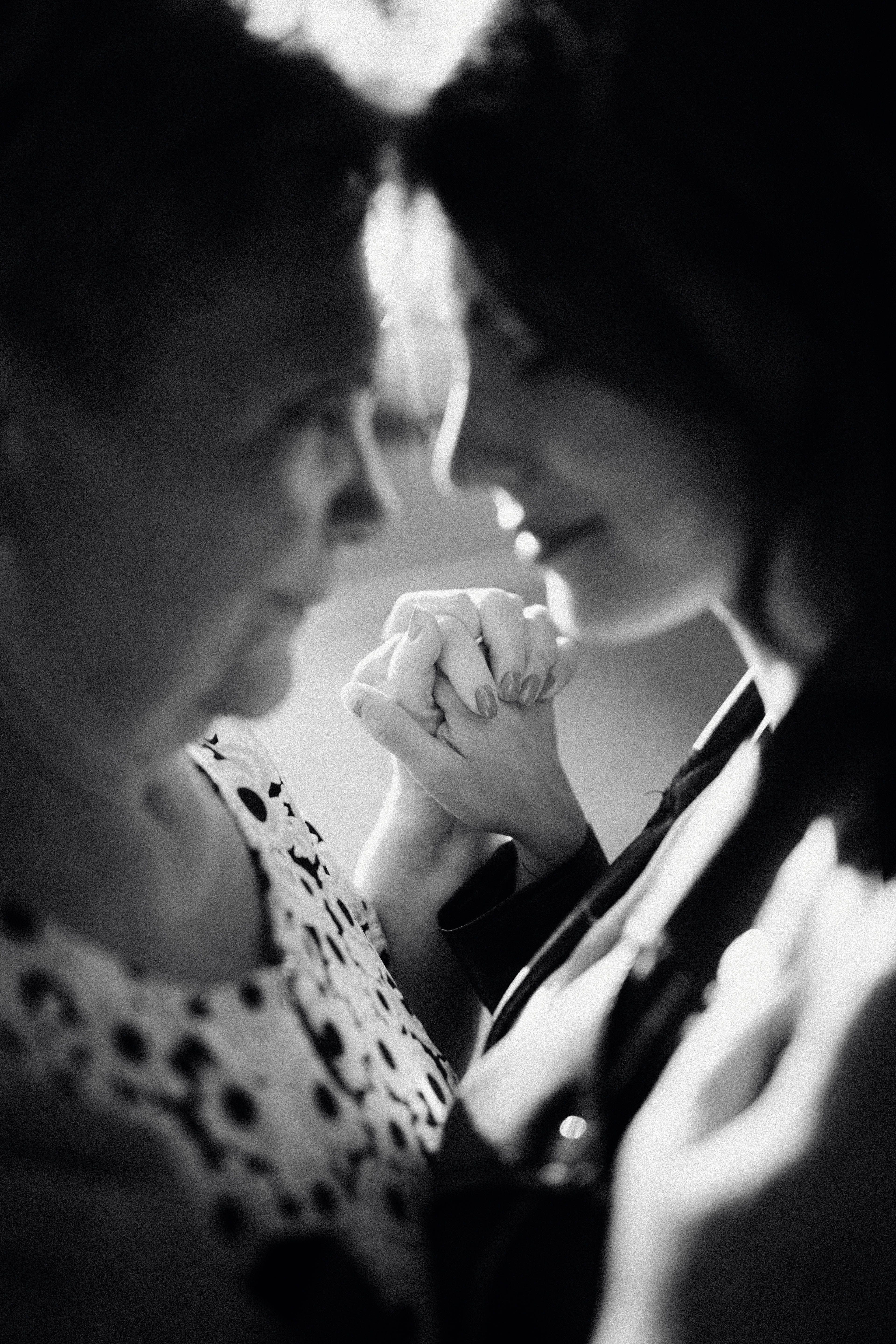 Mother and Daughter Holding Hands in Black and White · Free Stock Photo