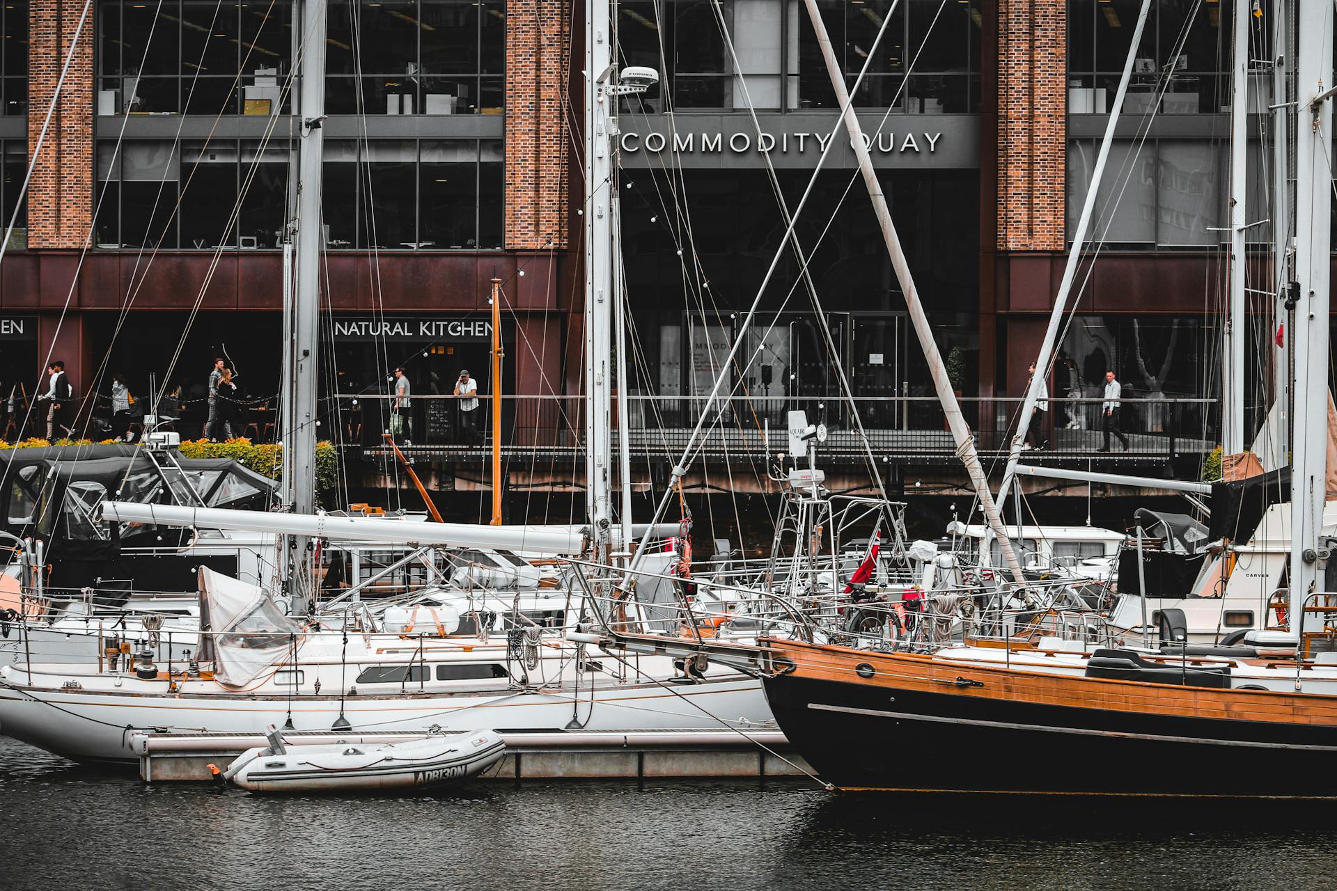 Luxurious yachts moored at Commodity Quay, London, offering a glimpse of elegant maritime life.