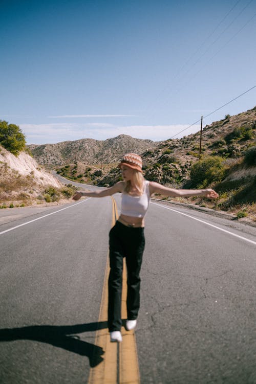 Model Posing in Pants on Road in Summer