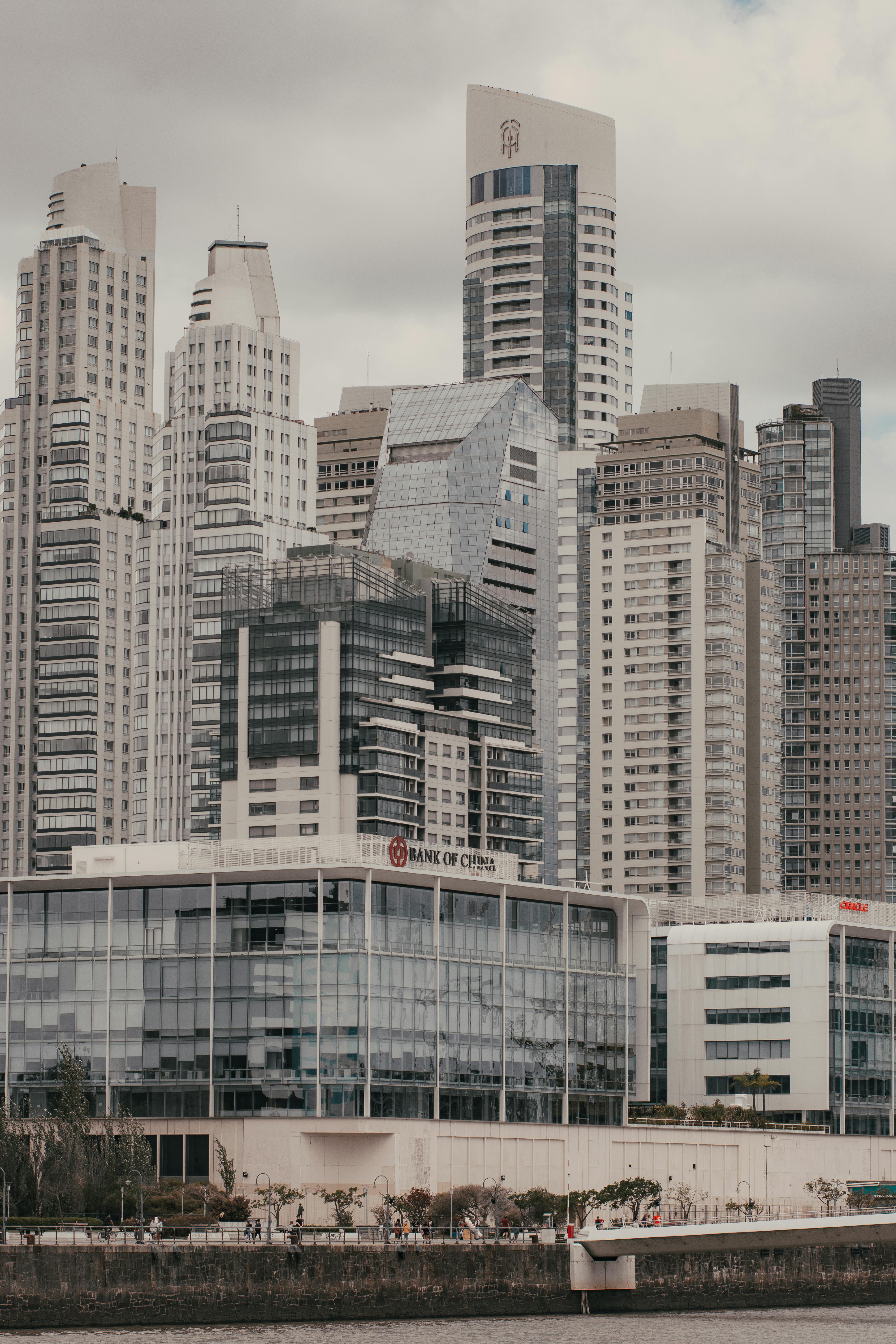 Stunning cityscape showcasing modern skyscrapers and urban architecture by the waterfront.