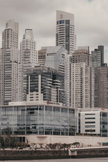 Stunning cityscape showcasing modern skyscrapers and urban architecture by the waterfront.