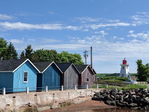 Free Colourful sheds and lighthouse on Prince Edward Island Stock Photo
