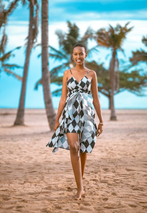 Smiling Woman in Sundress on Beach