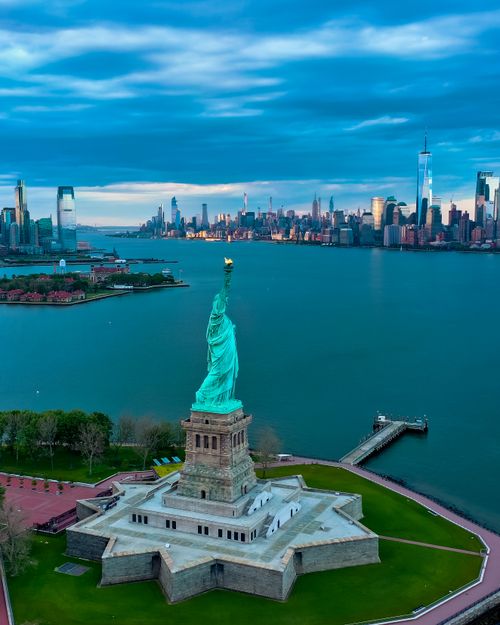 Free Stunning aerial perspective of the Statue of Liberty with Manhattan skyline in the background. Stock Photo