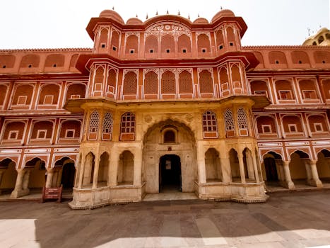 Explore the intricate facade of the City Palace in Jaipur, India, showcasing traditional Rajasthani design.