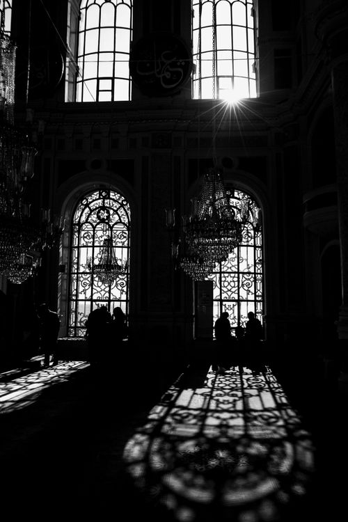 Free Black and white arches with stained glass casting shadows in İstanbul. Stock Photo