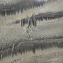 海滩上的抽象沙子结构，具有自然图案和纹理