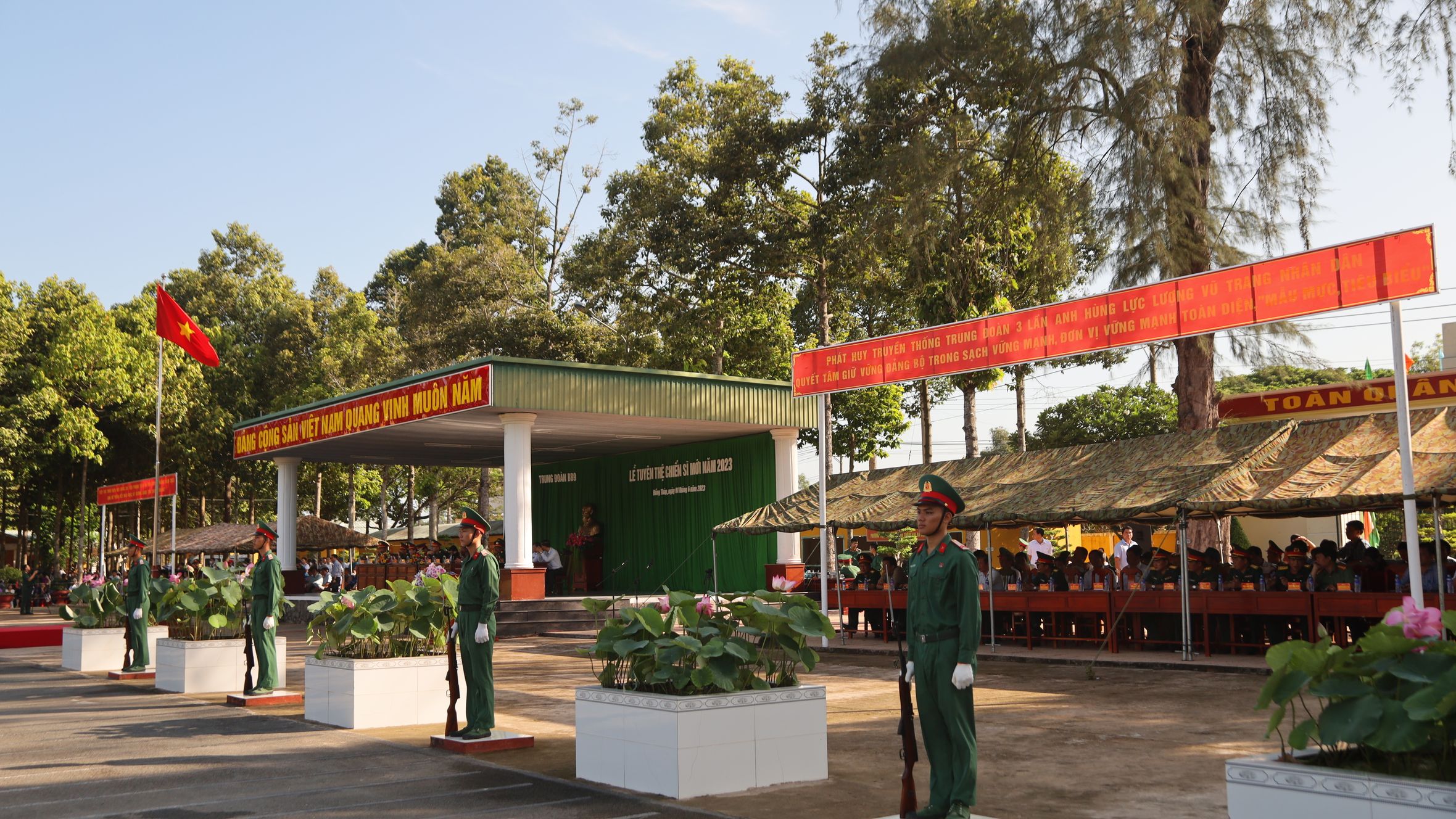 Vietnam military event with uniformed soldiers in a formal outdoor ceremony.