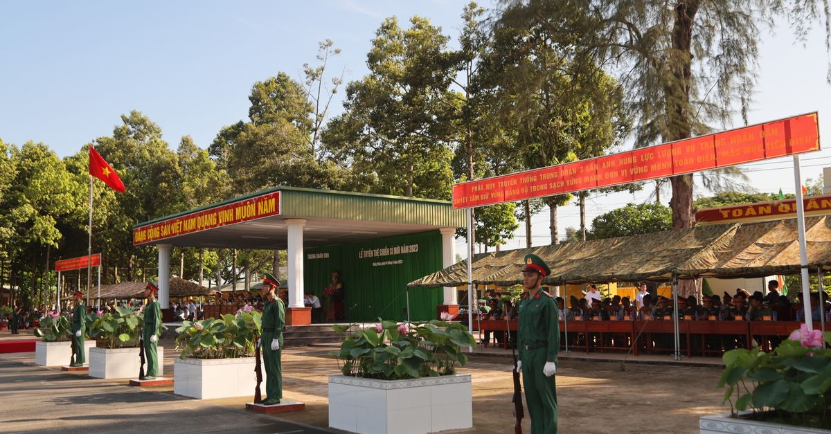 Vietnam military event with uniformed soldiers in a formal outdoor ceremony.