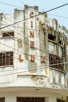 Vintage facade of the abandoned Cinelux theater in Chiapa de Corzo, Mexico with weathered architecture.