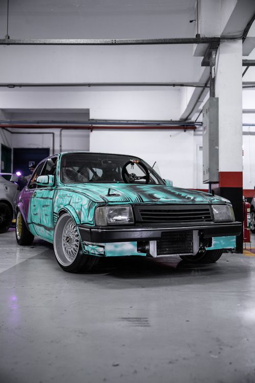 Free Custom-painted vintage Chevrolet Chevette displayed in a São Paulo garage. Stock Photo