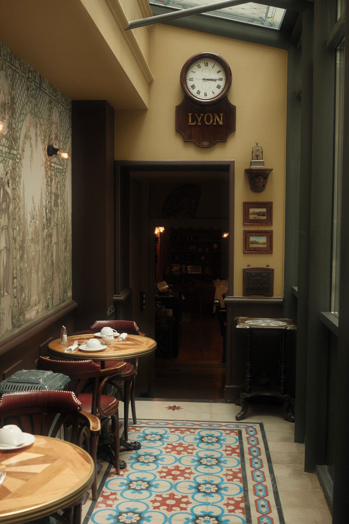 A vintage Lyon bistro interior with mosaic floor