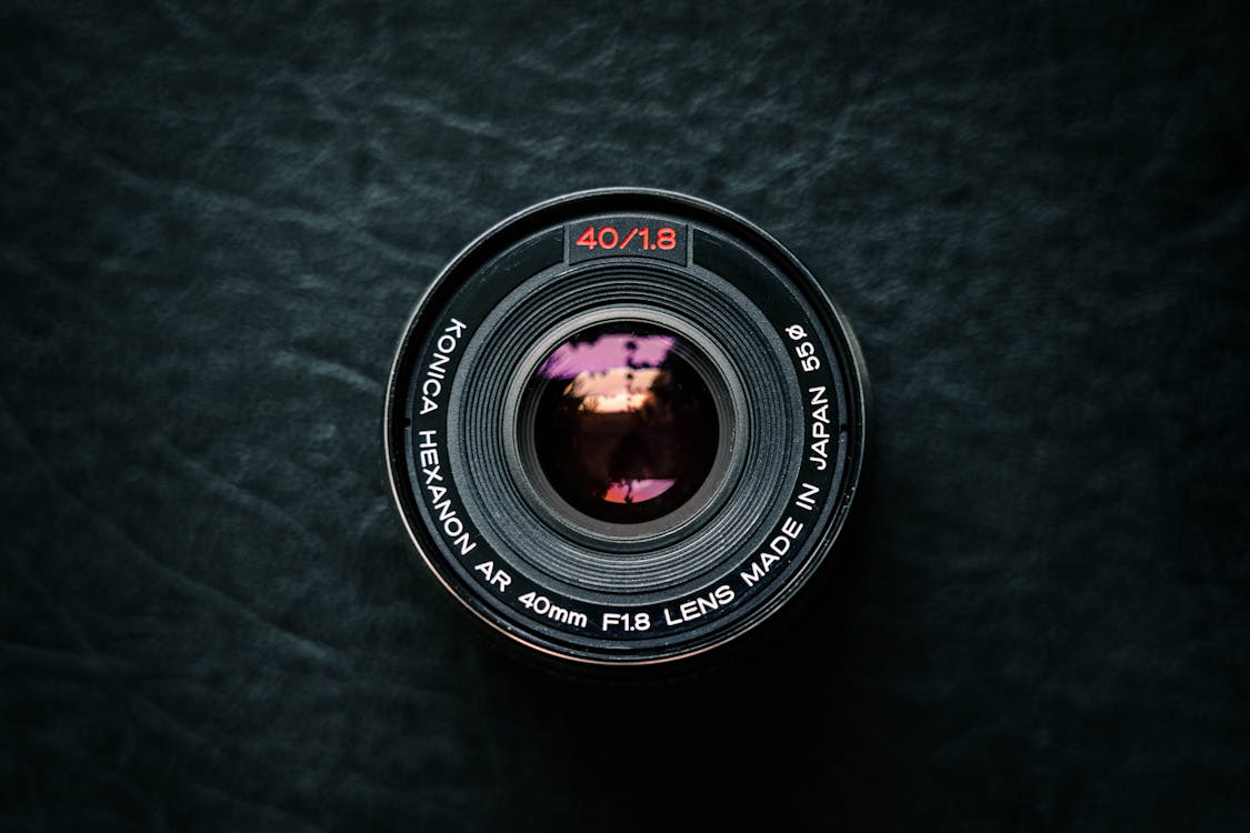 Camera Lens On Black Surface