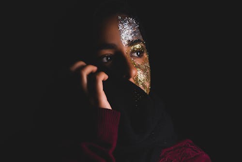 Close-Up Photo of Woman With Glitters On Her Face