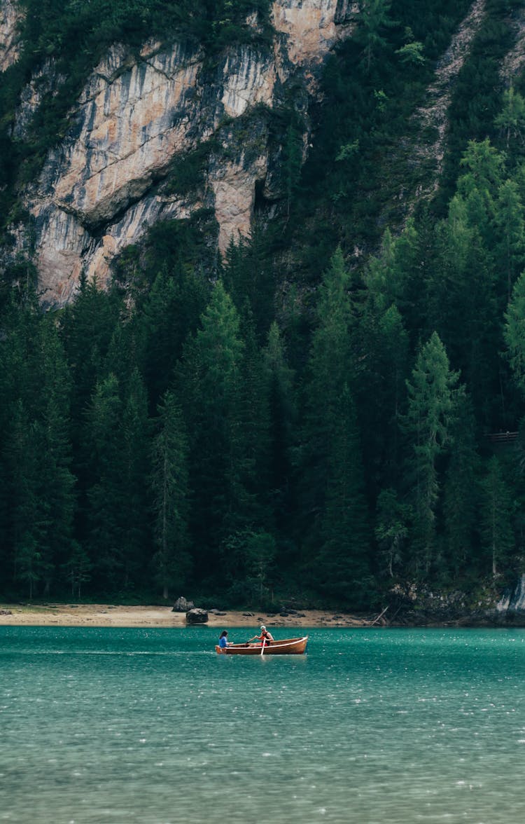 People Boating On Lake