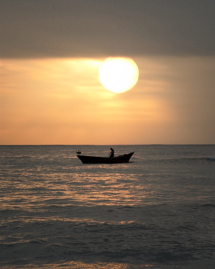 Sun Over Boat At Sunset