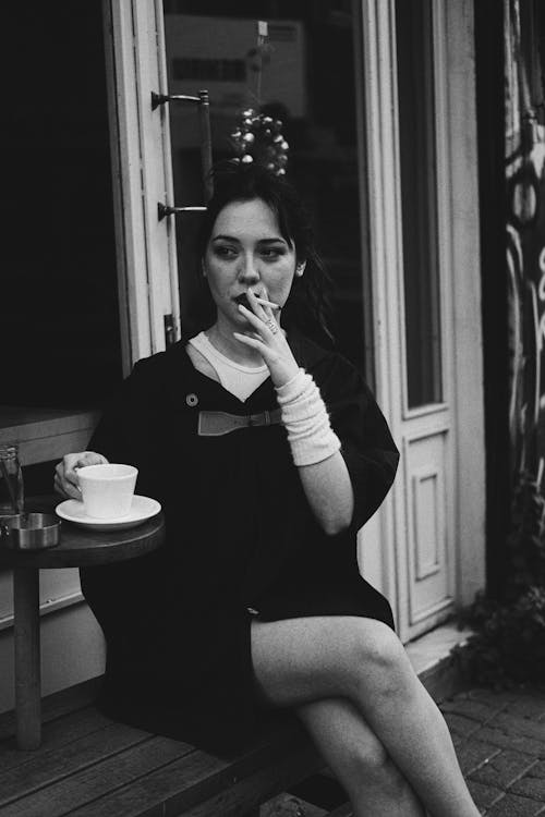 Woman Posing and Smoking Cigarette