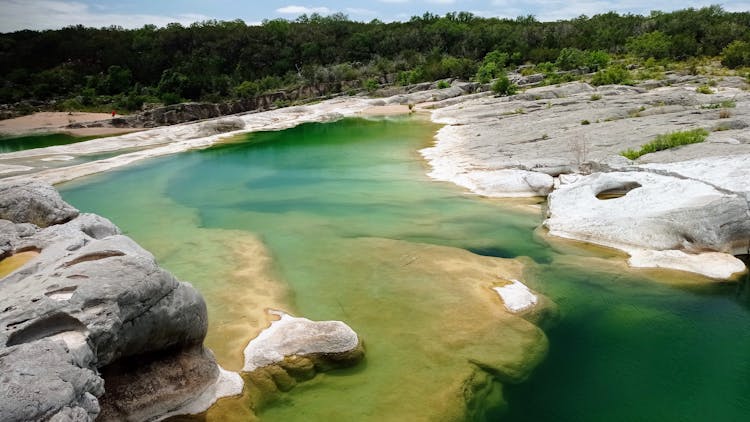 Clear Turquoise Water In A Scenic Limestone Lake