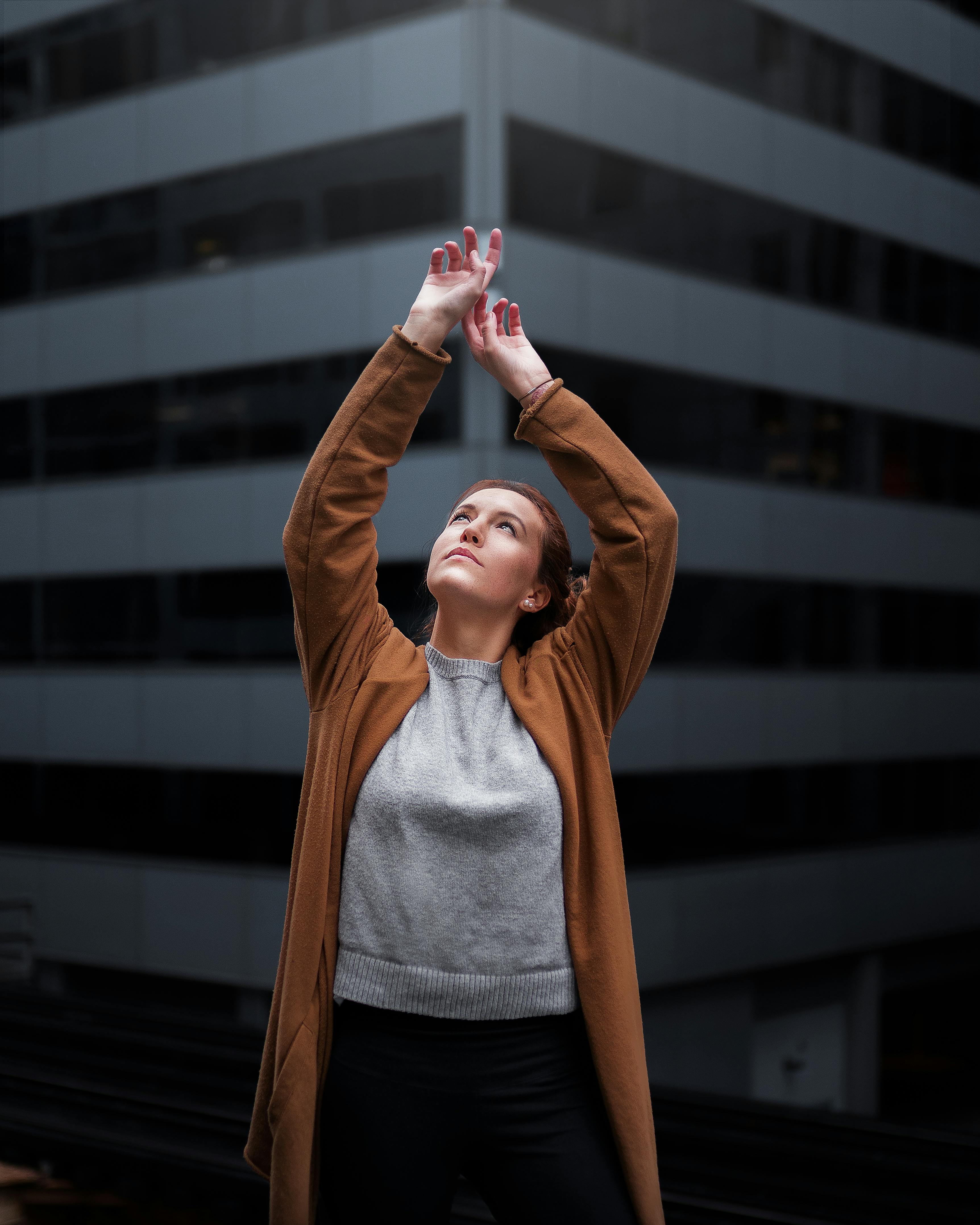 woman raising hands