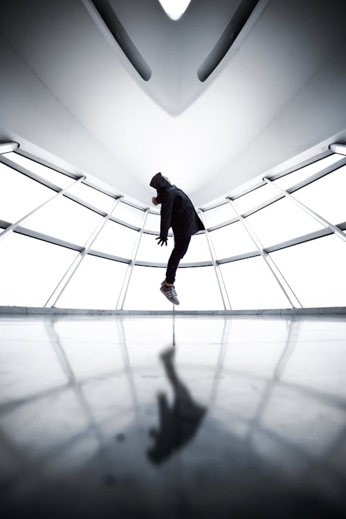 Free Grayscale Photo of Levitating Person Stock Photo