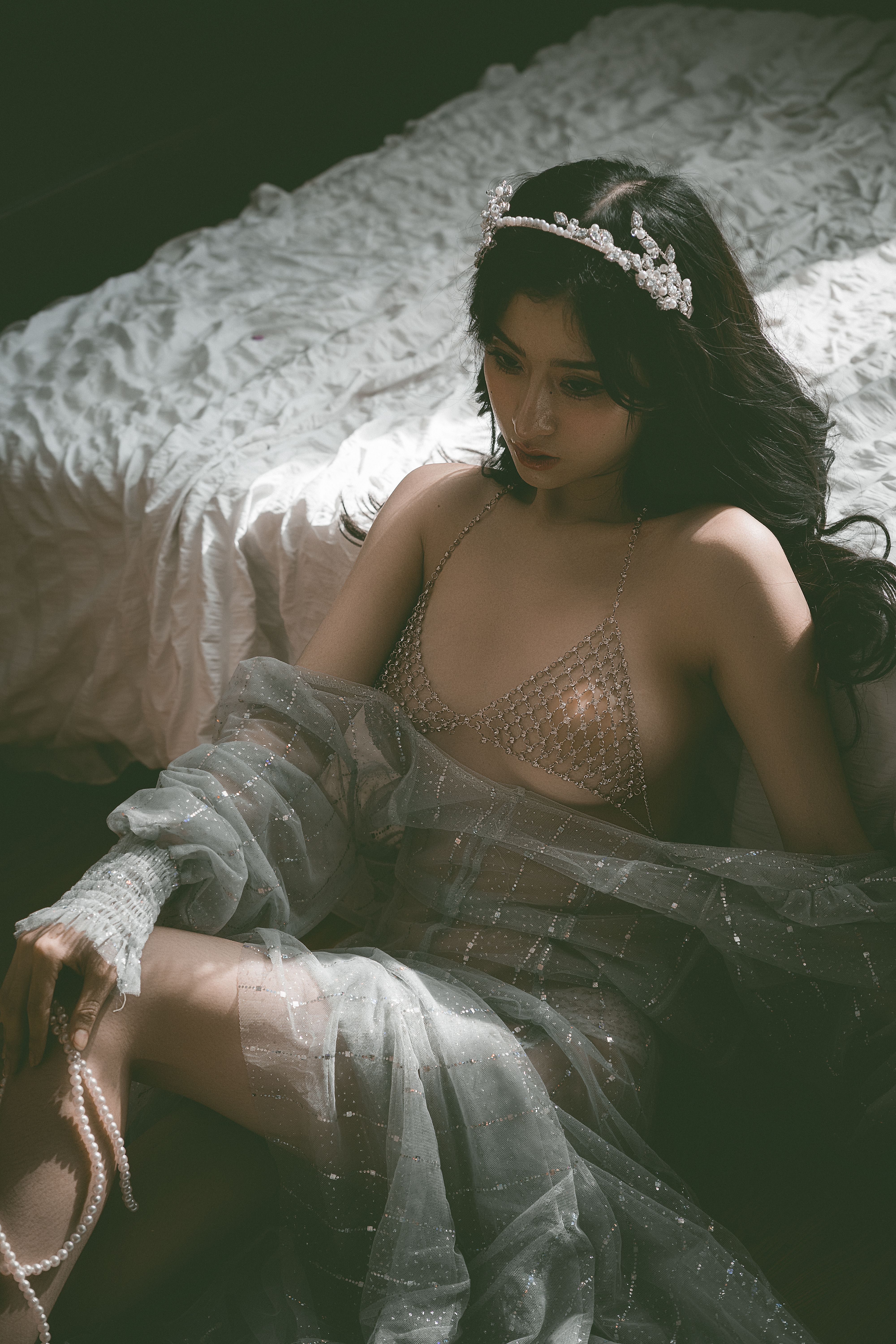 Woman in See-through Dress Leaning Back on Bed  Free Stock Photo