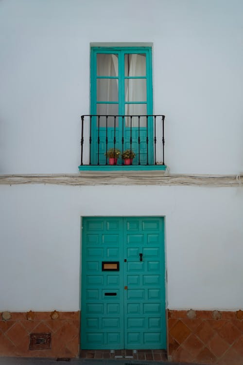 Facade with Turquoise Balconys Door and Main Entrance