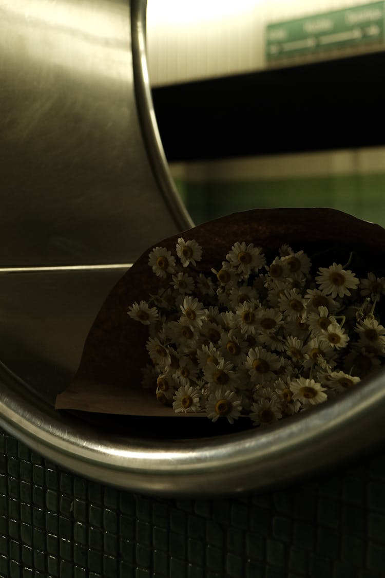 Bouquet Lying In Round Wall Hole