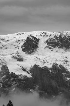 Stunning black and white photo of snowy mountains in Berchtesgaden, Germany.