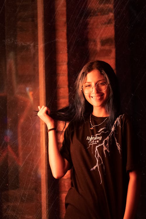 Smiling Woman Standing by Window