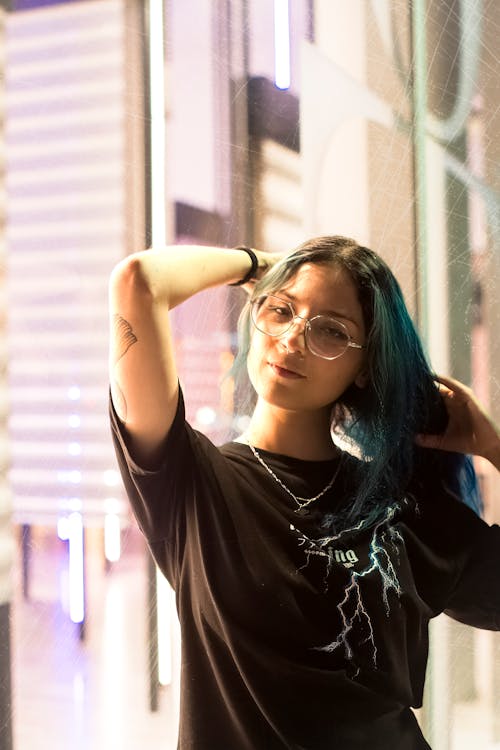 Portrait of Woman Fixing Hair