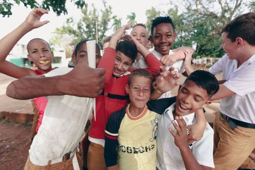 Free A vibrant group of boys enjoying and playing together in a park setting. Stock Photo