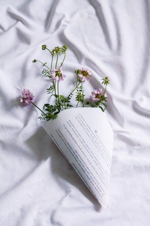 A Bunch of Wildflowers Wrapped in Paper
