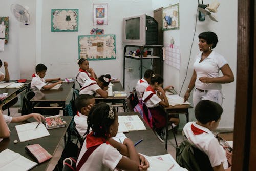 Kids and a Teacher in a Classroom 