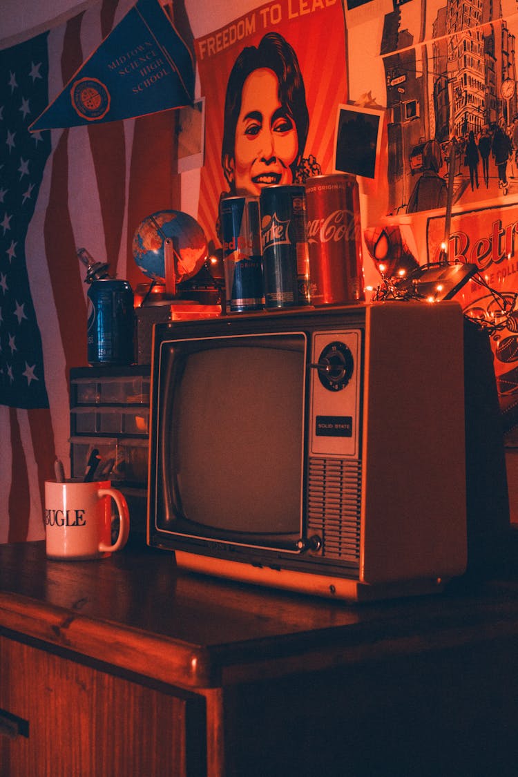 Drinks Cans On Retro TV In Dark Room