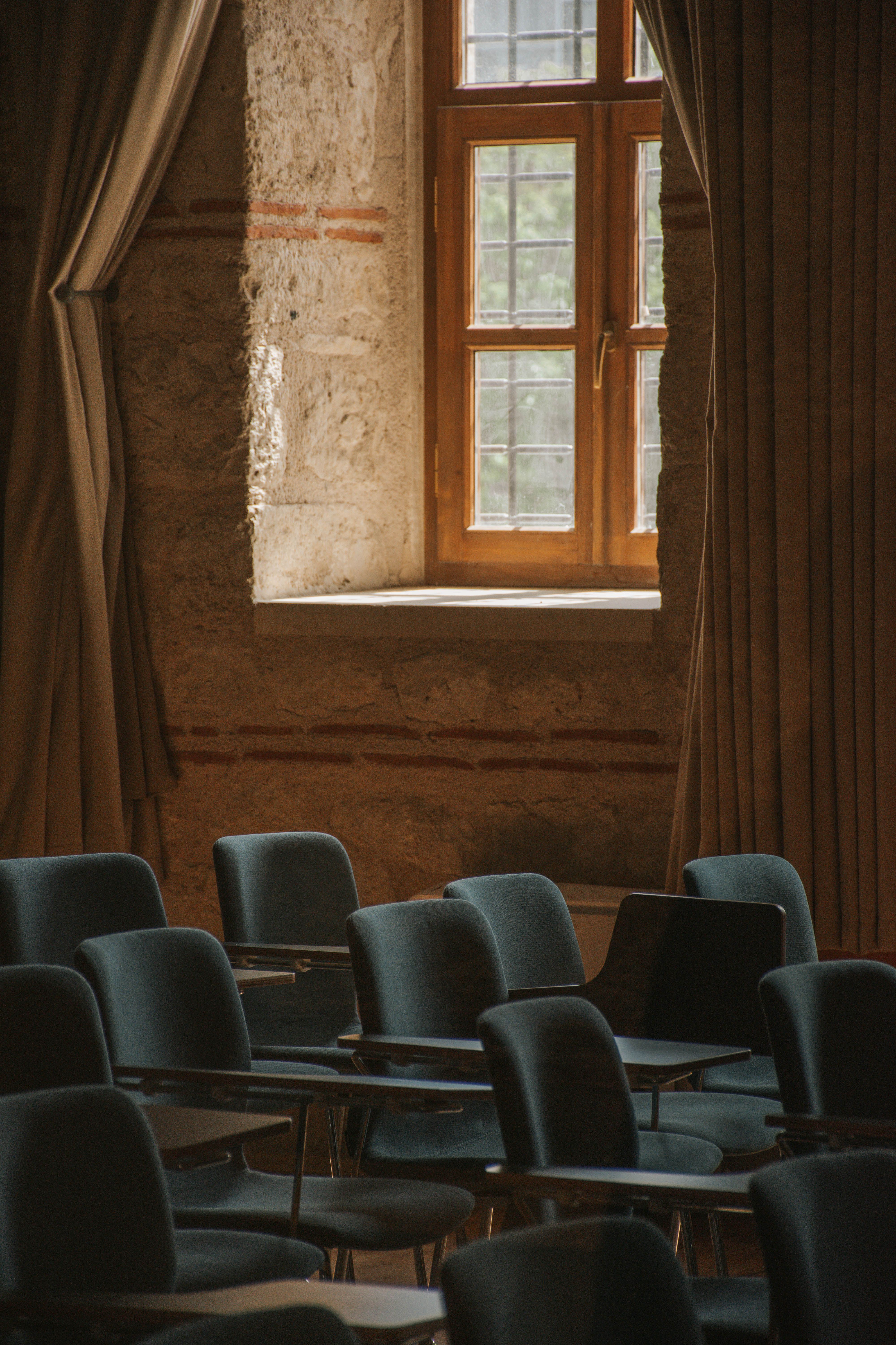 A meeting room with two chairs facing each other across a small table