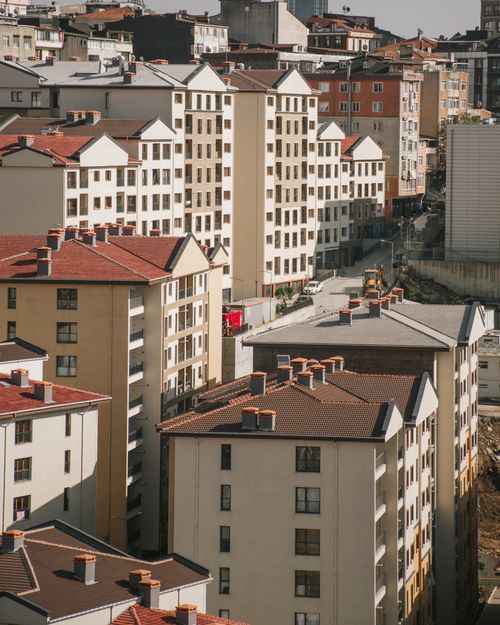 Free An aerial shot capturing the dense urban landscape of modern residential buildings. Stock Photo