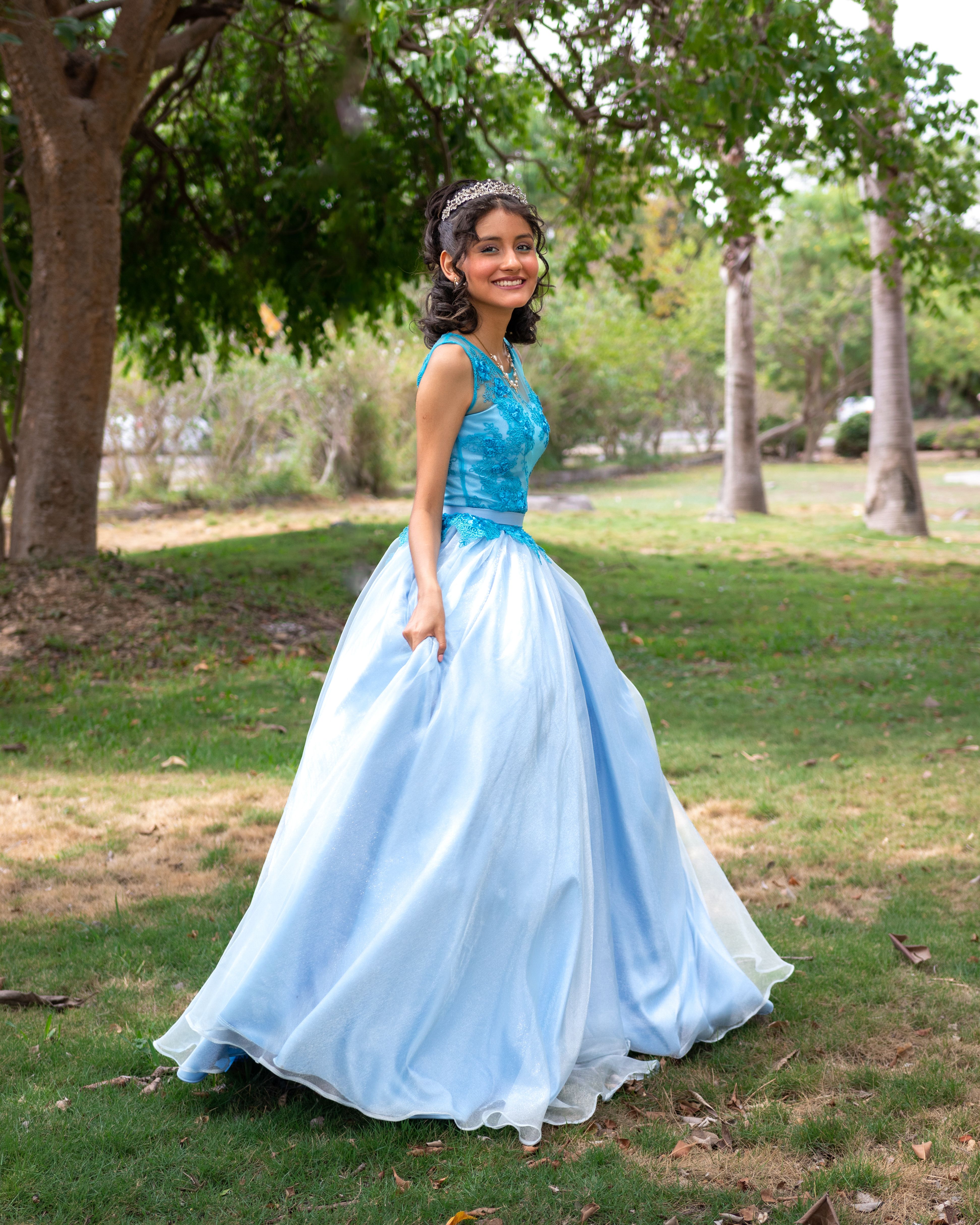 Smiling Woman in Blue Dress at Park  Free Stock Photo